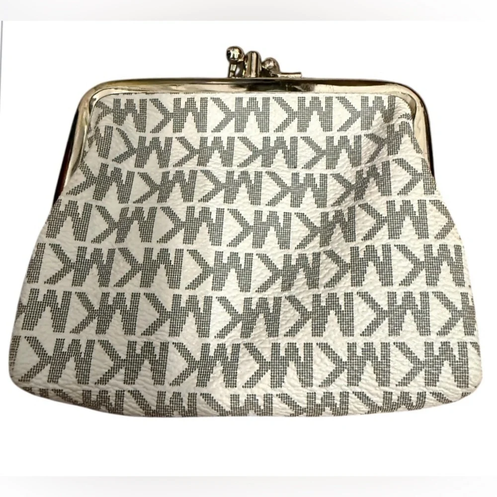 Michael Kors signature white and gray change purse with a clasp closure